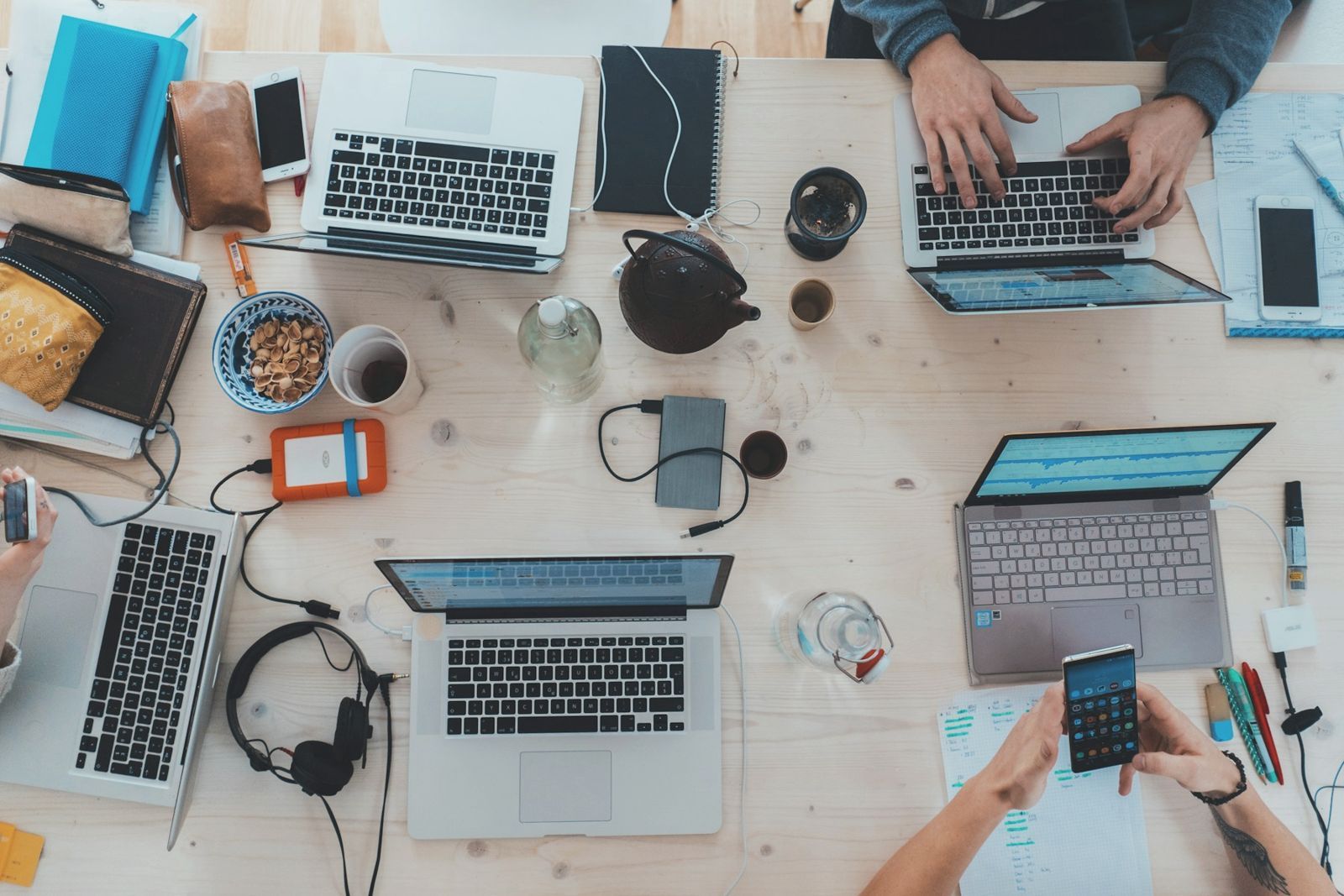 Overhead view of a team working around a shared table